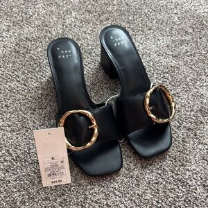 A New Day Black and Gold Mules with Sleek Design